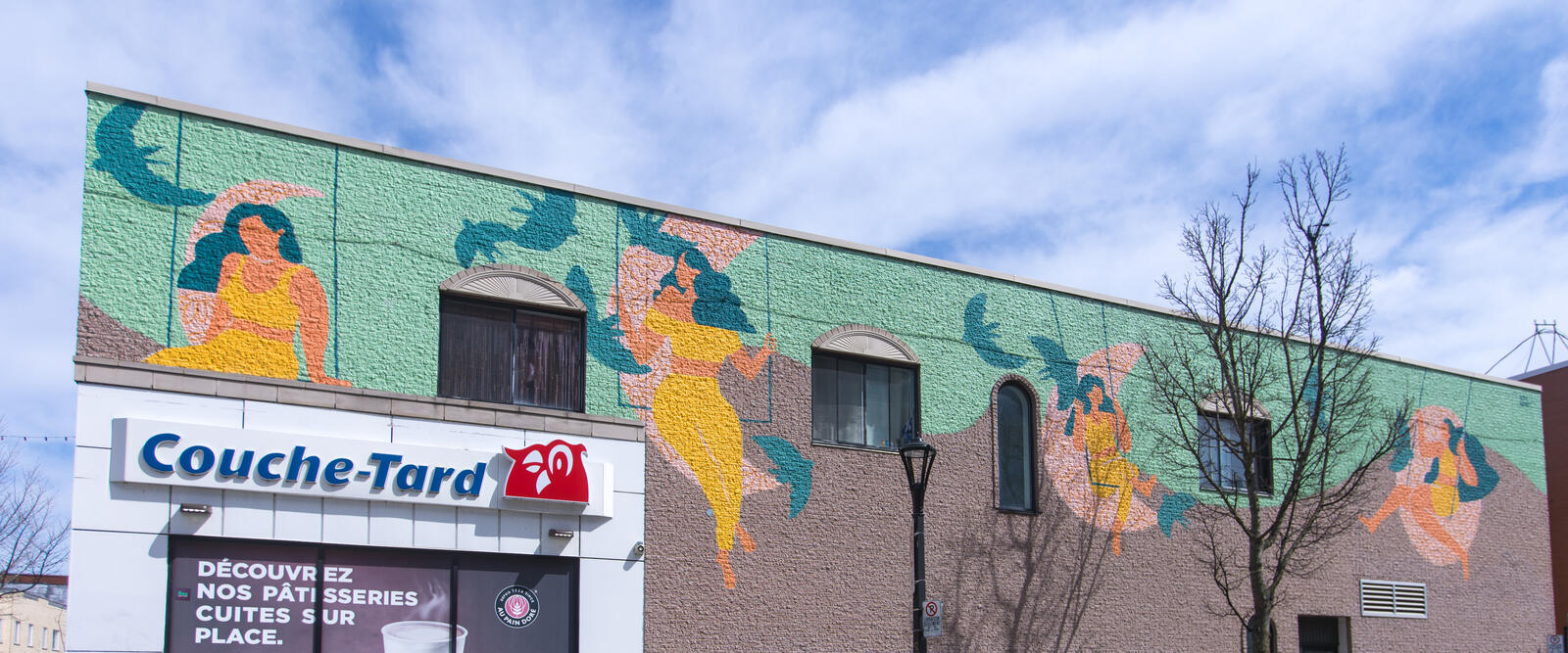 Murale panoramique sur un mur commercial de la Promenade Masson